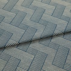 A folded piece of fabric with Rebel Indigo Blue printed on it