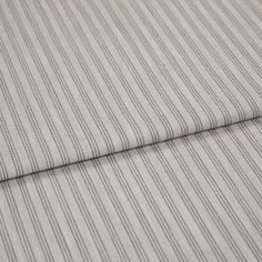 A folded piece of fabric with Shelby Mushroom Cream printed on it