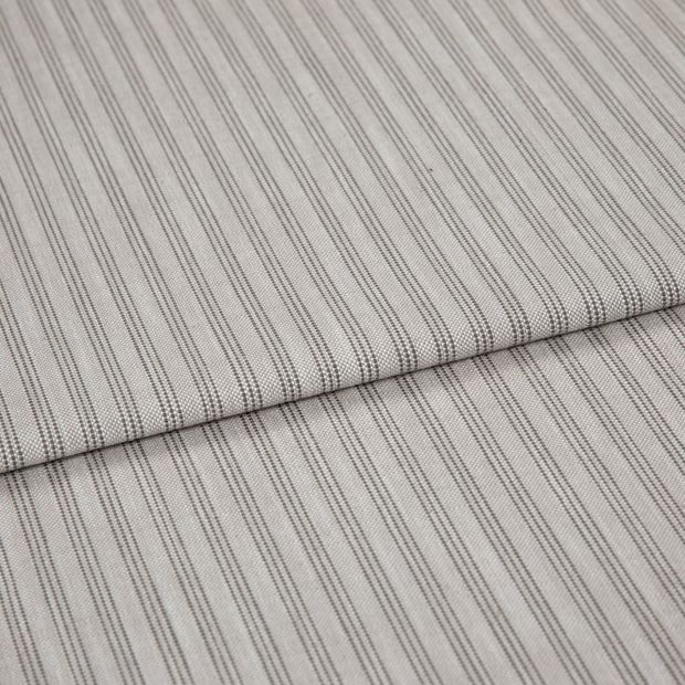 A folded piece of fabric with Shelby Mushroom Cream printed on it