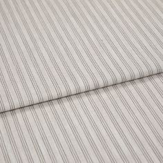 A folded piece of fabric with Shelby Charcoal Grey printed on it