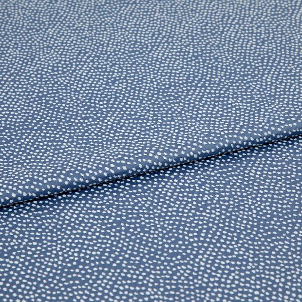 A folded piece of fabric with Spritz Cornflower Blue printed on it