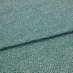 A folded piece of fabric with Spritz Elm Green printed on it