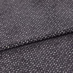 A folded piece of fabric with Wave Graphite Black printed on it