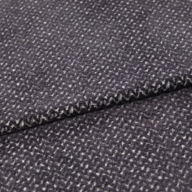 A folded piece of fabric with Wave Graphite Black printed on it