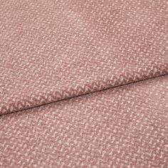 A folded piece of fabric with Wave Rose Blush Pink printed on it