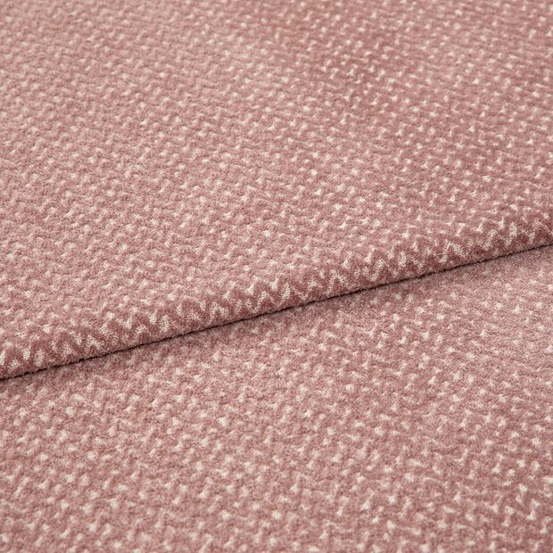 A folded piece of fabric with Wave Rose Blush Pink printed on it