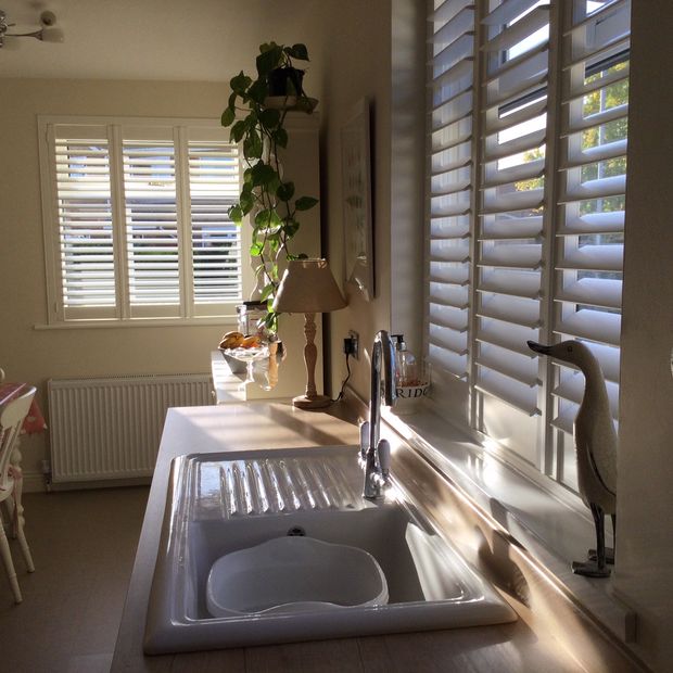 Crisp linen shutters in kitchen