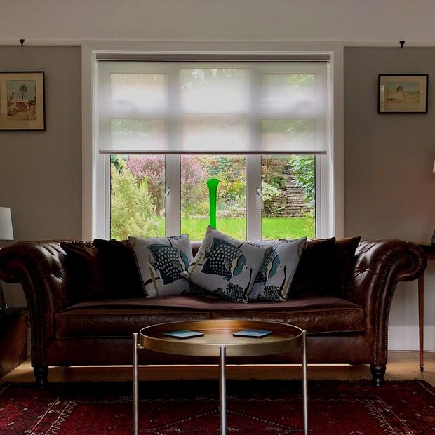 Purity white sheer roller blind on large patio windows
