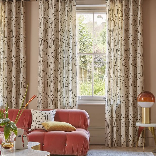 Nora putty floor length eyelet curtains in cosy pink themed living room