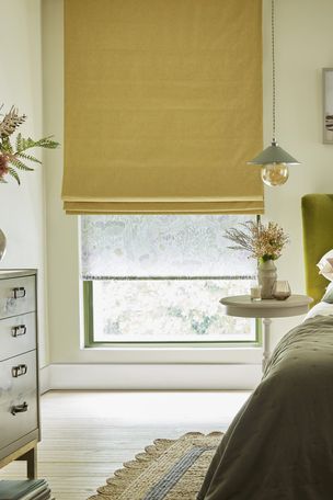 Harper sunshine roman blinds paired with daisy spring roller blinds in pastel themed bedroom