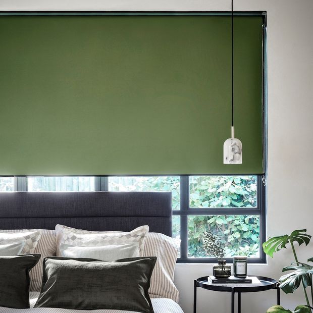 cordova pesto green blackout roller blinds in bedroom