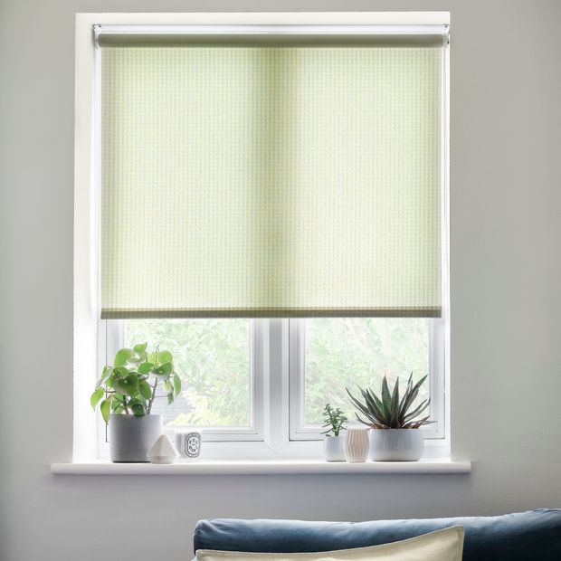 Dapple lime roller blind in living room