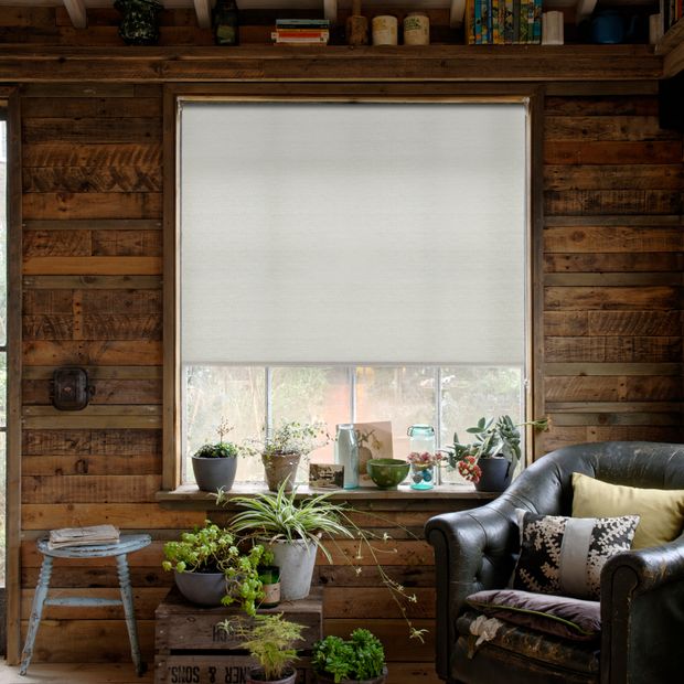 Macrame ecure roller blind in rustic living room