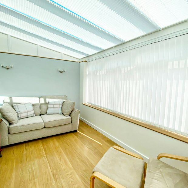 hexham white vertical blinds in open sunny conservatory space
