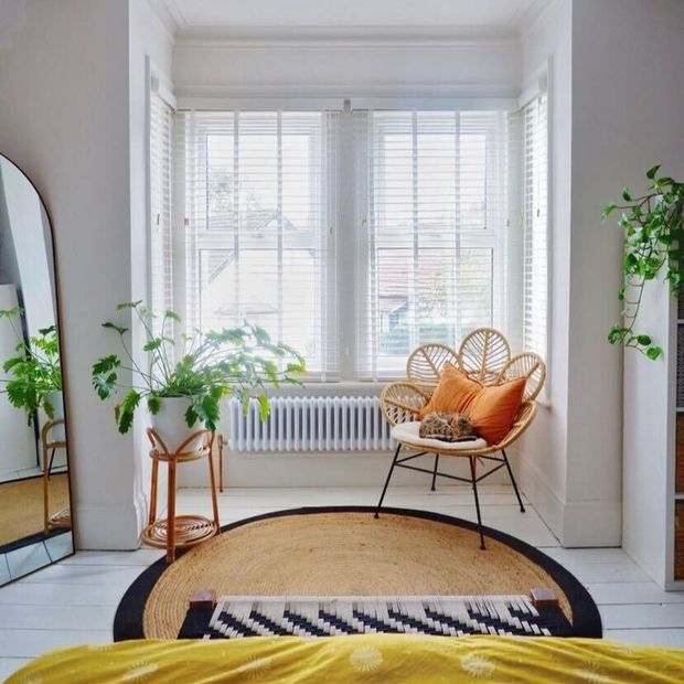 natural stone faux wood venetian blinds in box bay window in cosy bedroom