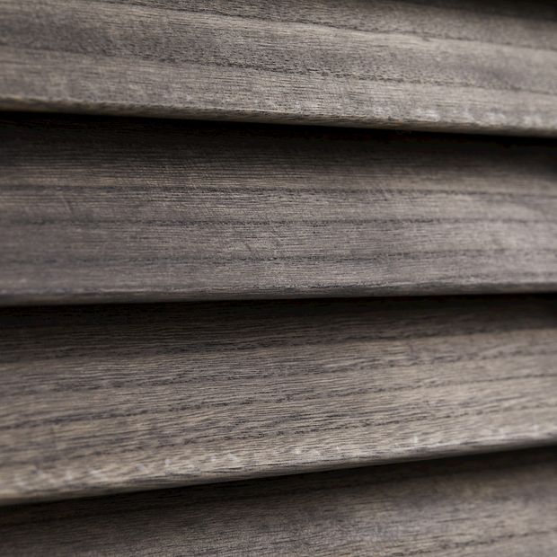close up of rustic black wood grain shutters