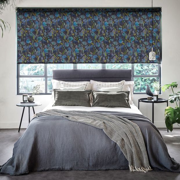 Grace indigo floral blackout roller blind on window above bed