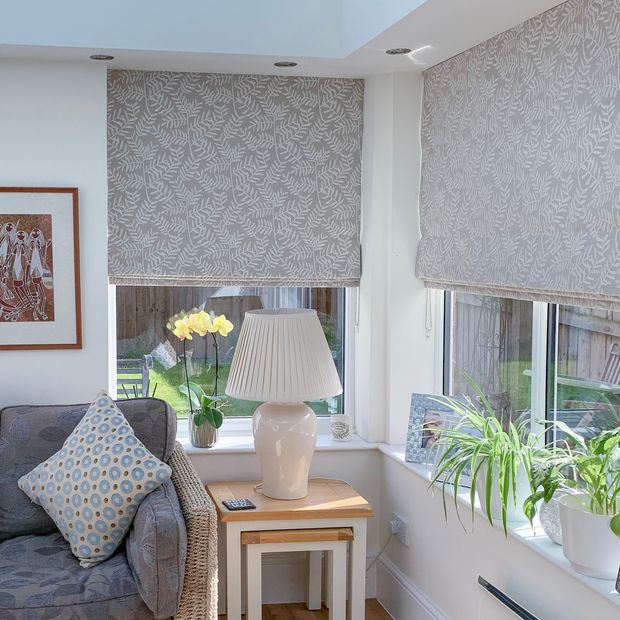grey leafy roman blind on conservatory windows