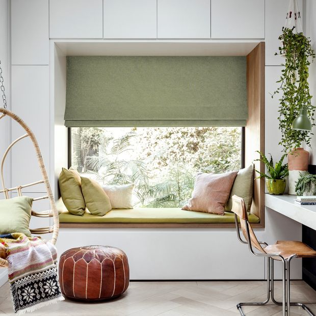 huxley moss roman blind above furnished window ledge in home office with chair, desk, and hanging egg chair