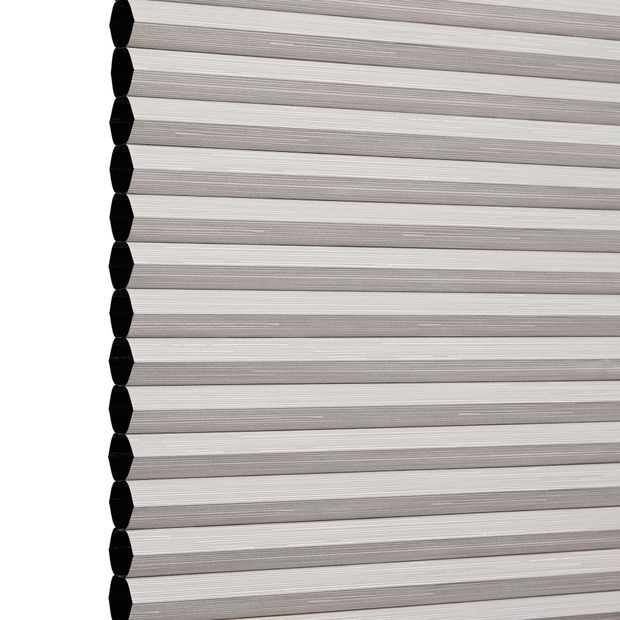Stone Thermashade swatch is a mid-to-light grey shad- image has an angle view, showing the side of the pleated blind