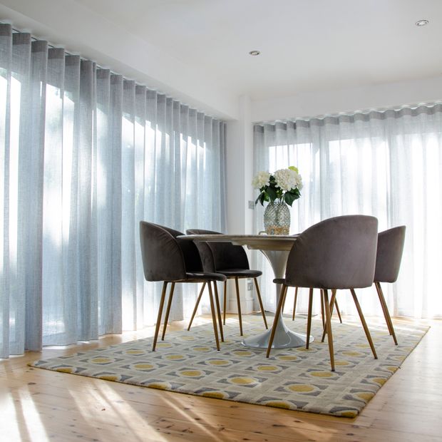 fully closed sheer silver voiles on bifold doors with intu pleated blinds in dining room