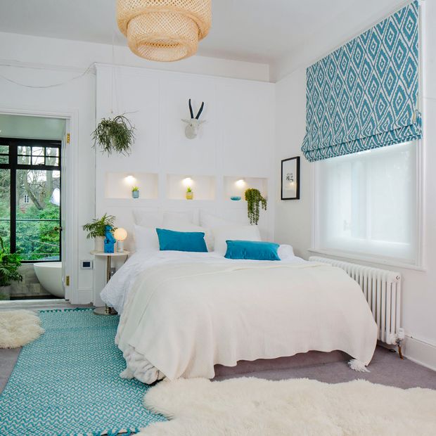 mali peacock blue geometric roman blind on bedroom window