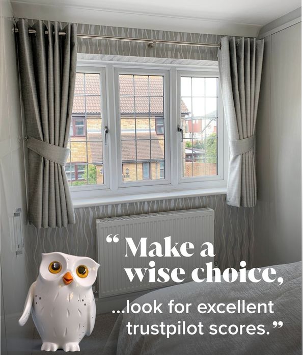 short grey eyelet curtains on bedroom window with window wise overlay
