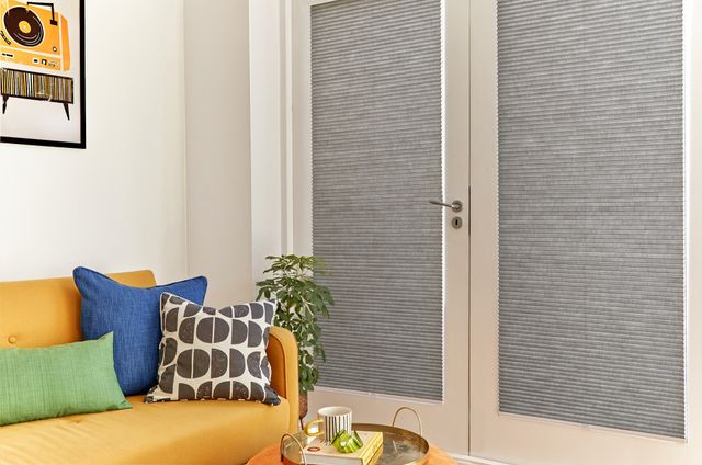 duette charcoal pleated blinds on french doors in living room