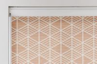 coral patterned roller blind with full cassette header