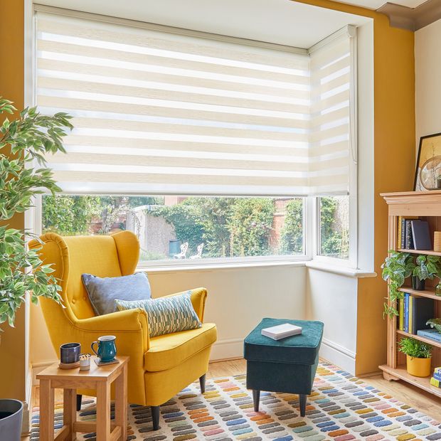 daybreak cream day and night blinds on box bay window in small living room