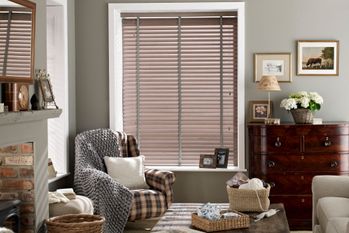 Brown wooden blinds shading a living room