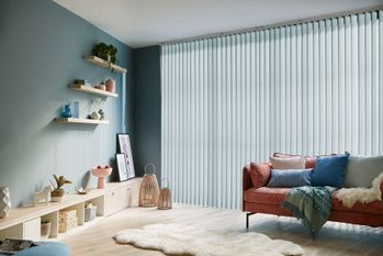 Blue vertical blinds in a blue themed living room