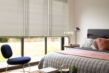Fruitwood metal venetian in a neutral coloured bedroom