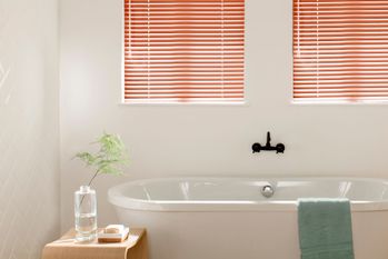 Red russet metal venetian in white bathroom