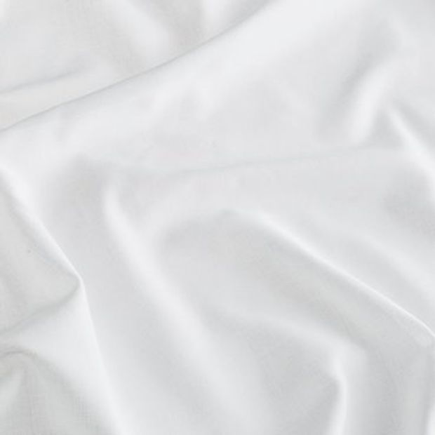 White coloured fabric swirled on a surface