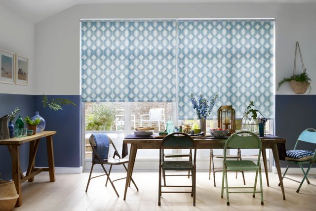 denim blue and white roman blinds in dining room with chairs and table with food displayed on it