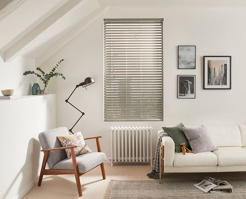 Modern minimalist living room with silver Venetian blinds