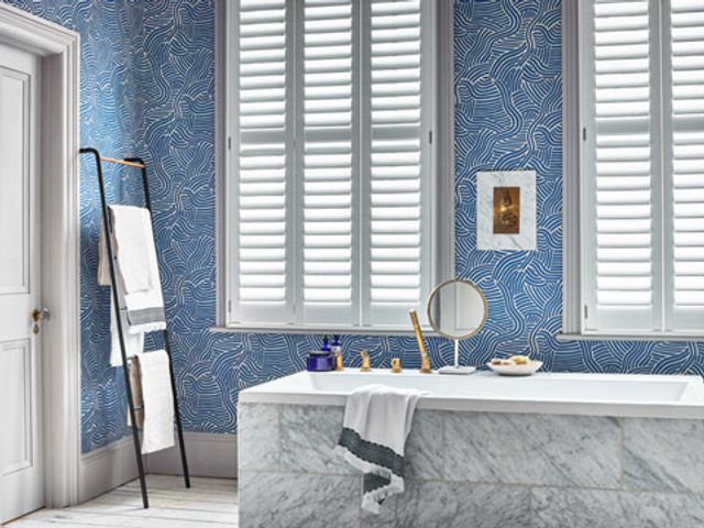 Henley white full height shutters in bathroom