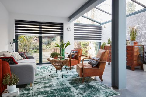 Large design conservatory with black Day & Night blinds in the open position 