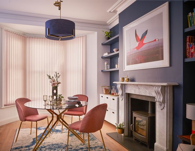 light pink vertical blinds in a dining room window 