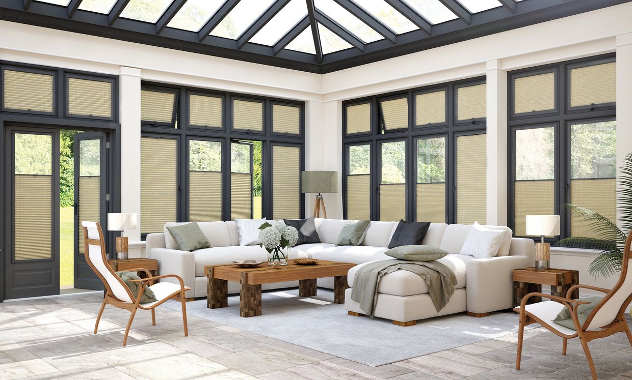 cream perfect fit blinds in a modern conservatory living room 