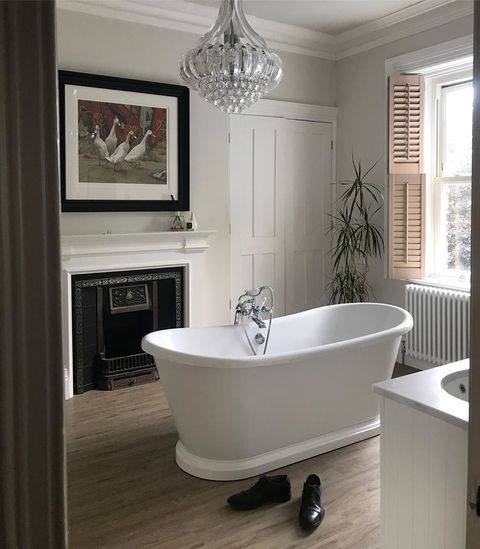 brown Tarcked tier on tier String Shutters with tilt bars shutters in a bathroom