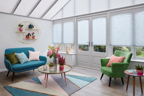 Natural pale grey Pleated blinds dressed on doors and windows, with white Highgrove Pleated blinds on the conservatory roof.