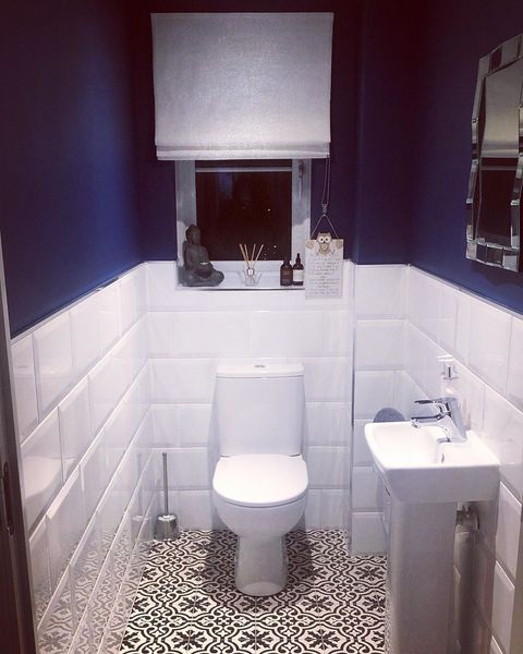 White roman blinds dressed on window of bathroom