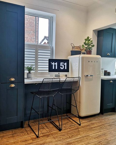 Pure White shutters in blue kitchen with bar stools