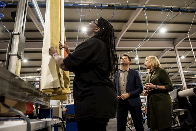 George Clarke in one of the Hillarys factory seeing someone make a curtain