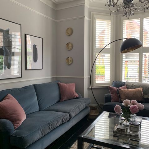 White tier on tier shutters in a grey modern living room
