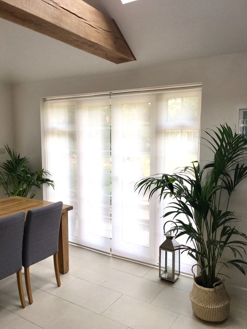 Sheer Roller blinds against patio doors
