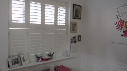 Tier on Tier Shutters in a bedroom window