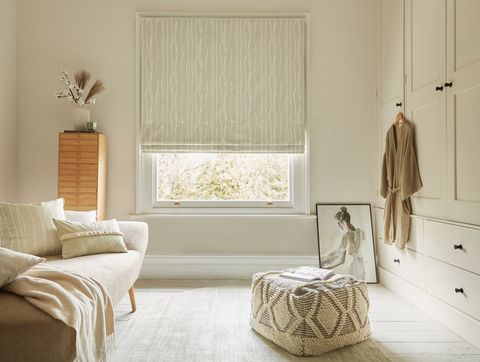 Flow Sesame roman blind in a dressing room window 